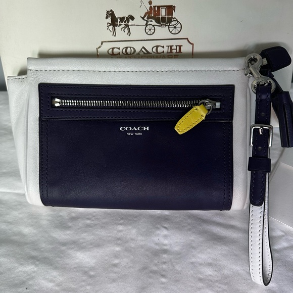 Coach Handbags - Coach Legacy Eggplant and Ivory Wristlet with Yellow Accent